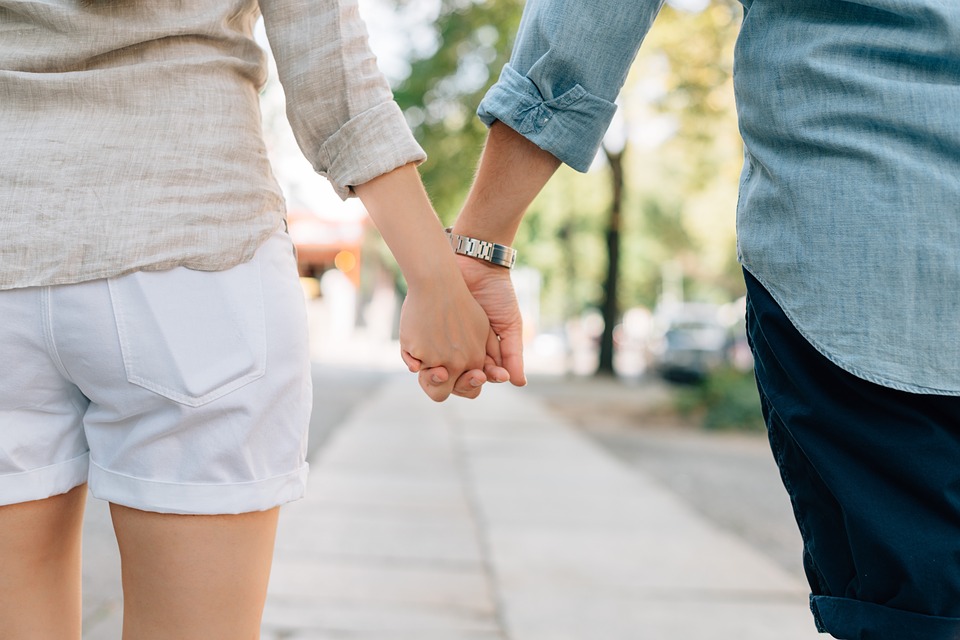 Couple holding hands